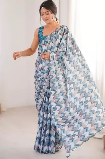 Blue heavy chinon printed saree with mirror work border