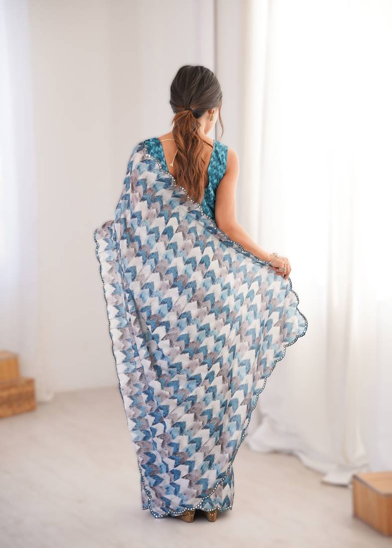 Blue heavy chinon printed saree with mirror work border
