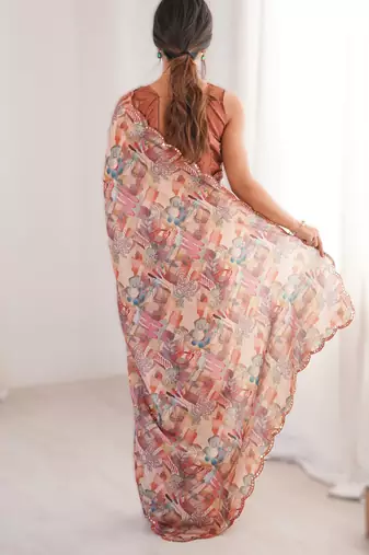 Peach chinon printed saree with mirror work border