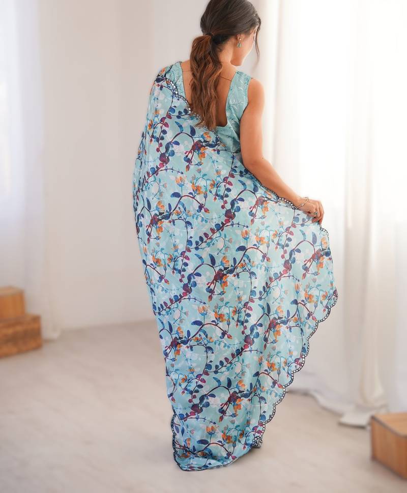 Sky blue heavy chinon printed saree with mirror work border