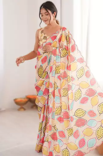 Yellow heavy chinon printed saree with mirror work border