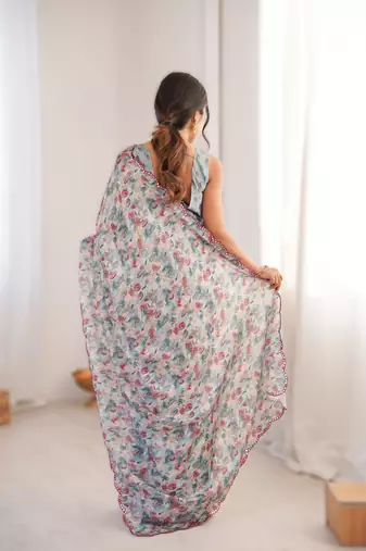 Blue chinon printed saree with mirror work border