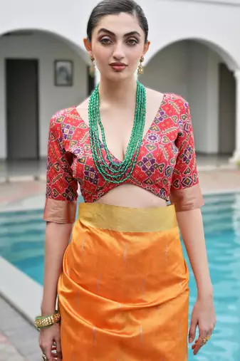 orange soft khadi raw art silk blend saree with patola pallu