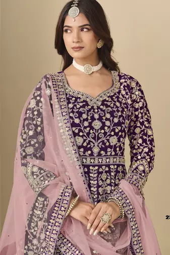 Purple velvet anarkali suit with net dupatta