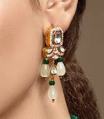 Gold plated kundan green stones dangler earrings