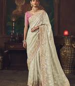 Off  white zari woven silk blend embroidered saree for wedding wear