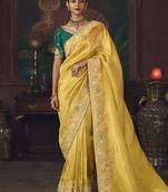 Yellow zari woven silk blend embroidered saree for wedding wear