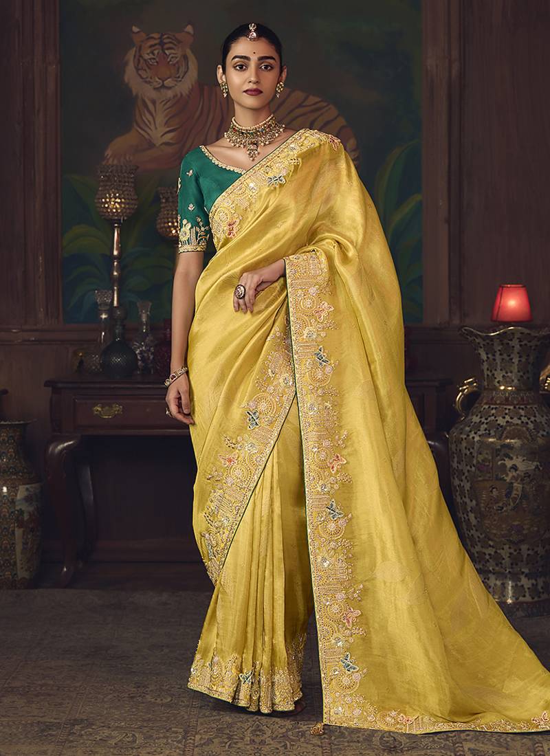 Yellow zari woven silk blend embroidered saree for wedding wear