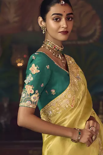 Yellow zari woven silk blend embroidered border saree