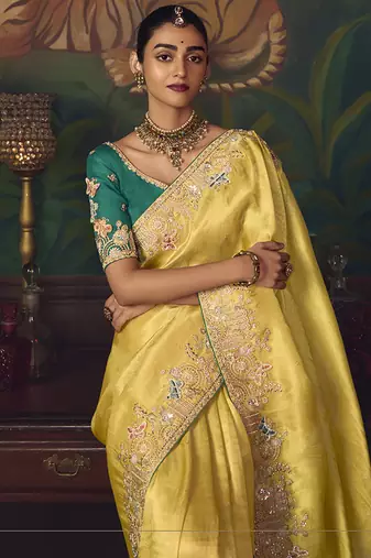 Yellow zari woven silk blend embroidered border saree