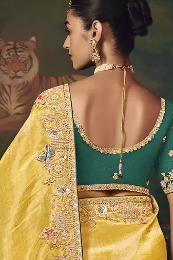 Yellow zari woven silk blend embroidered border saree