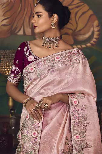 Light pink zari woven silk blend embroidered border saree