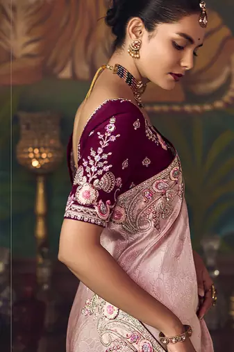 Light pink zari woven silk blend embroidered border saree