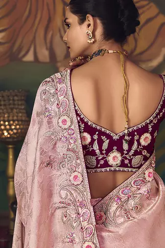 Light pink zari woven silk blend embroidered border saree