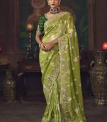 Parrot green zari woven silk blend embroidered saree for wedding wear