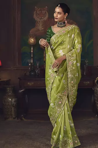 Parrot green zari woven silk blend embroidered border saree