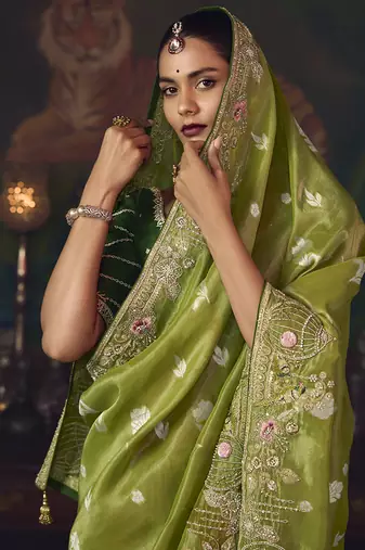 Parrot green zari woven silk blend embroidered border saree