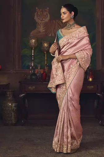Pink zari woven silk blend embroidered border saree
