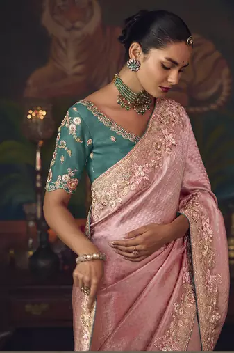 Pink zari woven silk blend embroidered border saree