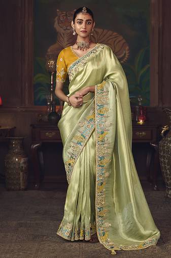 Light green zari woven silk blend embroidered saree for wedding wear