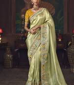Light green zari woven silk blend embroidered saree for wedding wear