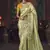 Light green zari woven silk blend embroidered border saree