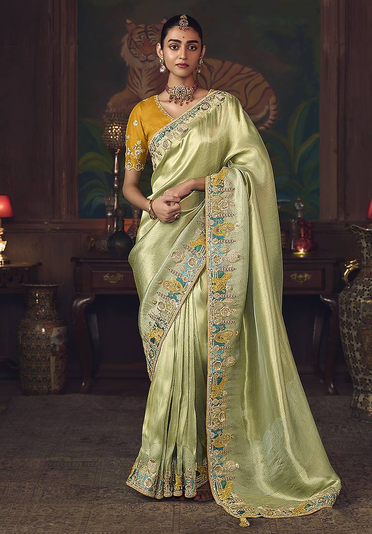 Light green zari woven silk blend embroidered saree for wedding wear