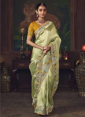 Light green zari woven silk blend embroidered border saree 2