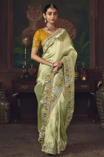 Light green zari woven silk blend embroidered border saree
