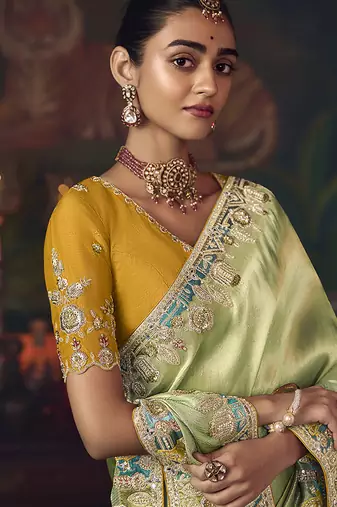 Light green zari woven silk blend embroidered border saree