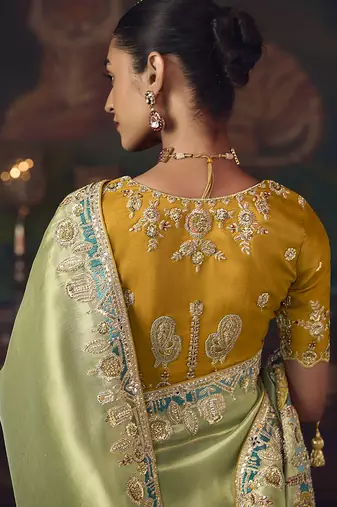 Light green zari woven silk blend embroidered border saree