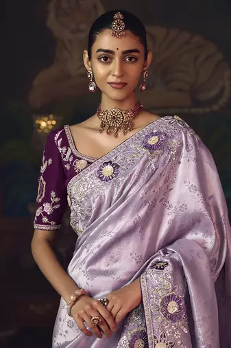 Lavender zari woven silk blend embroidered border saree