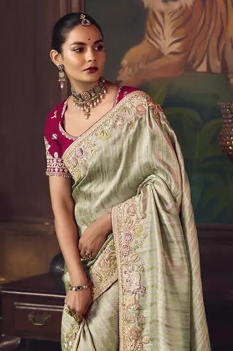 Sea green zari woven silk blend embroidered border saree