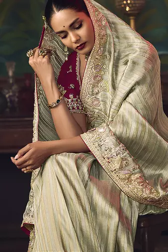 Sea green zari woven silk blend embroidered border saree
