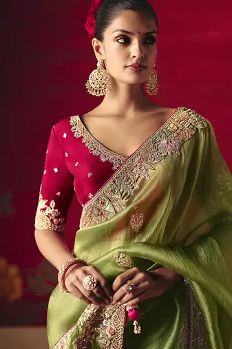 Green fancy fabric embroidered work saree