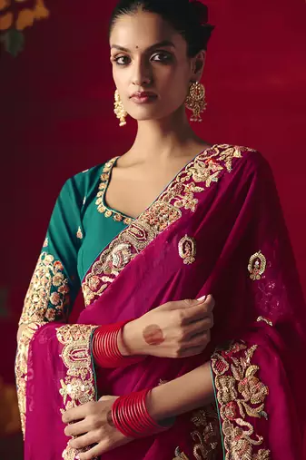 Rani pink fancy fabric embroidered work saree
