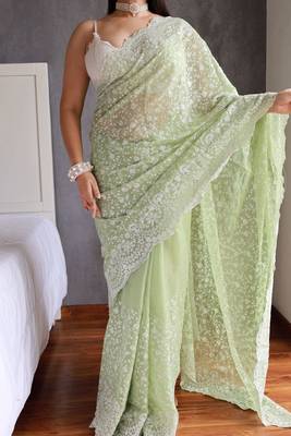 pastel green shimmer silk saree with embroidered border 1