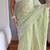 pastel green shimmer silk saree with embroidered border