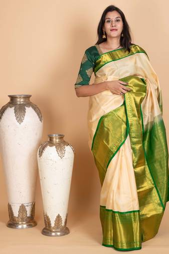 Parchment white and emerald green pure kanjivaram silk saree