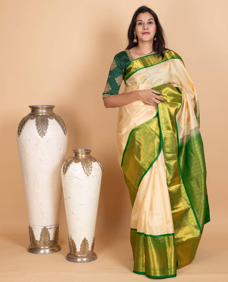Parchment white and emerald green pure kanjivaram silk saree
