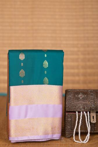 Teal blue and pastel lavender butta semi silk saree