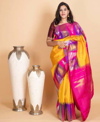 Tuscany yellow multi colour temple border silk saree 1