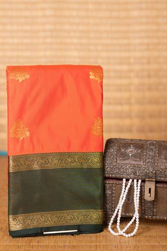 Neon orange and bottle green semi silk saree