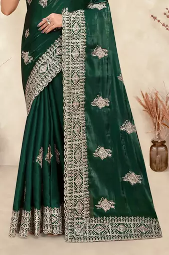 dark green crepe silk saree with coding zarkan work