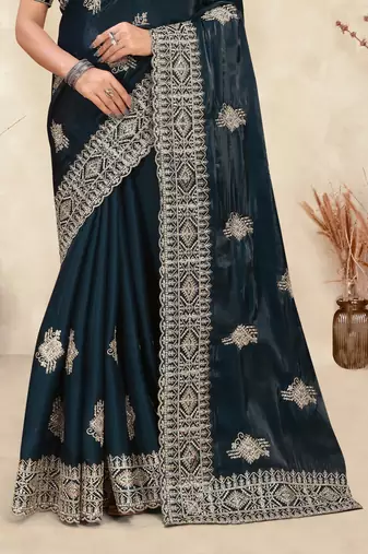 teal blue crepe silk saree with coding zarkan work