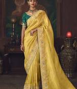 yellow silk blend with heavy embroidery work wedding wear designer saree