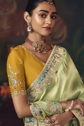 light pista silk blend with heavy embroidery work wedding wear designer saree