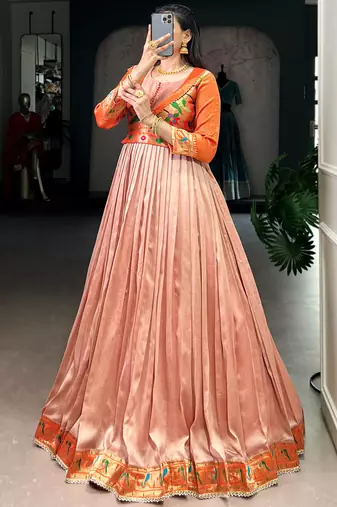 Captivating Peach Zari Weaving Silk Function Wear Gown