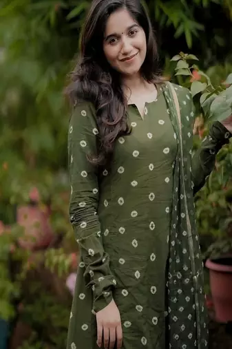 green floral embroidered boat neck cotton kurta with trouser and dupatta