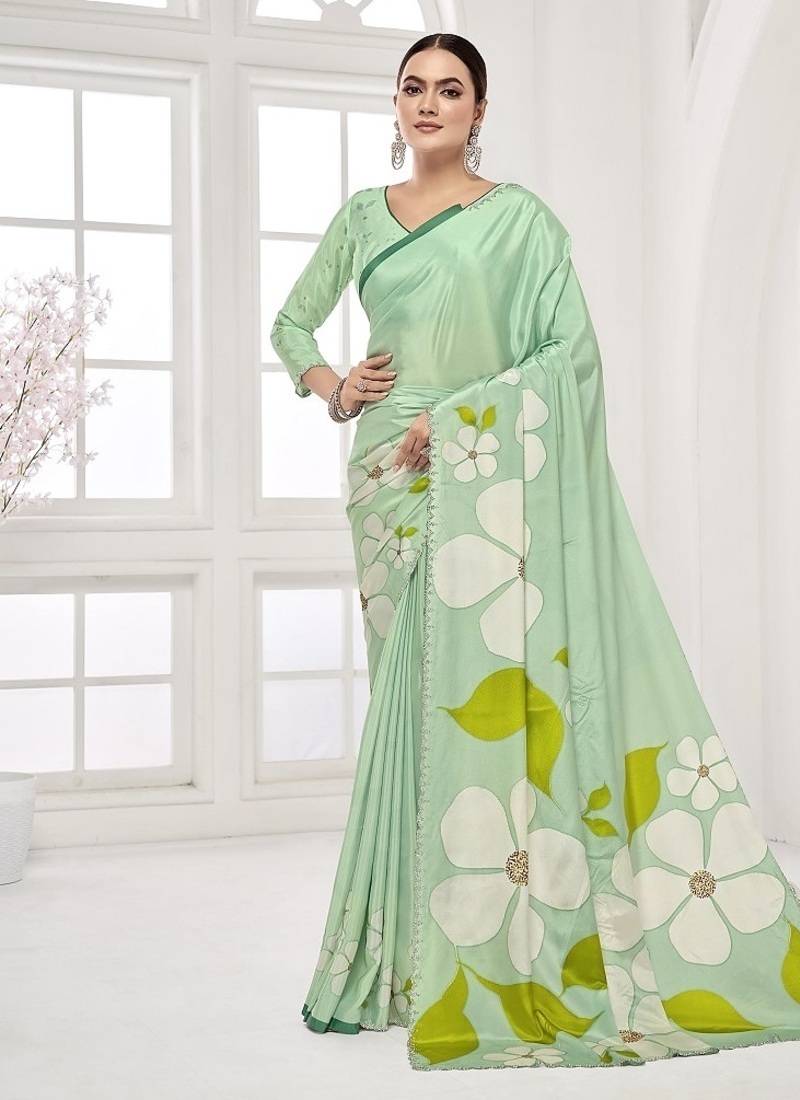 emerald light green  premium printed saree with blouse or saraowski border